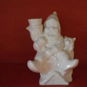 Jólasveinn sitjandi á þaki kertastjaki