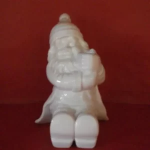 Sitjandi jólasveinn fyrir kerti